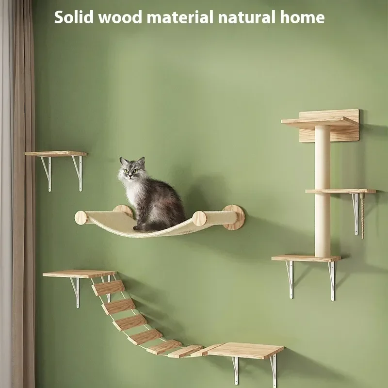 Two cats, one black and one grey, on a multi-level solid wood wall-mounted cat climbing rack with shelves, a bridge, a hammock, and a scratching post, in a modern living room